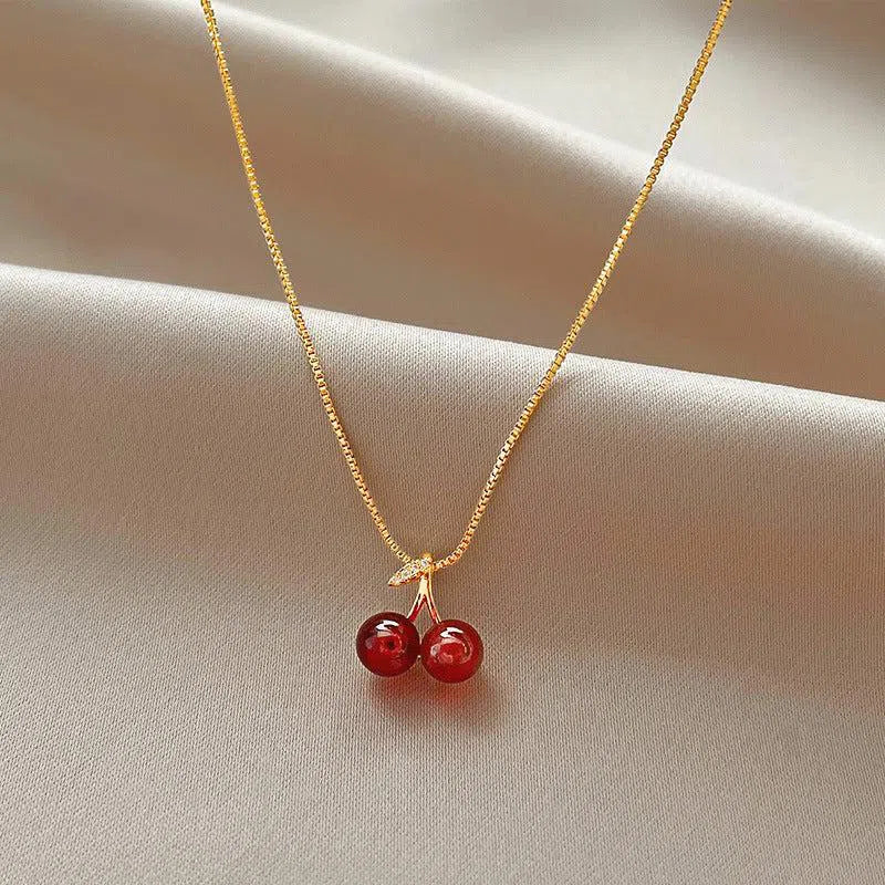 Cléora | Collier doré à breloques cerises scintillantes