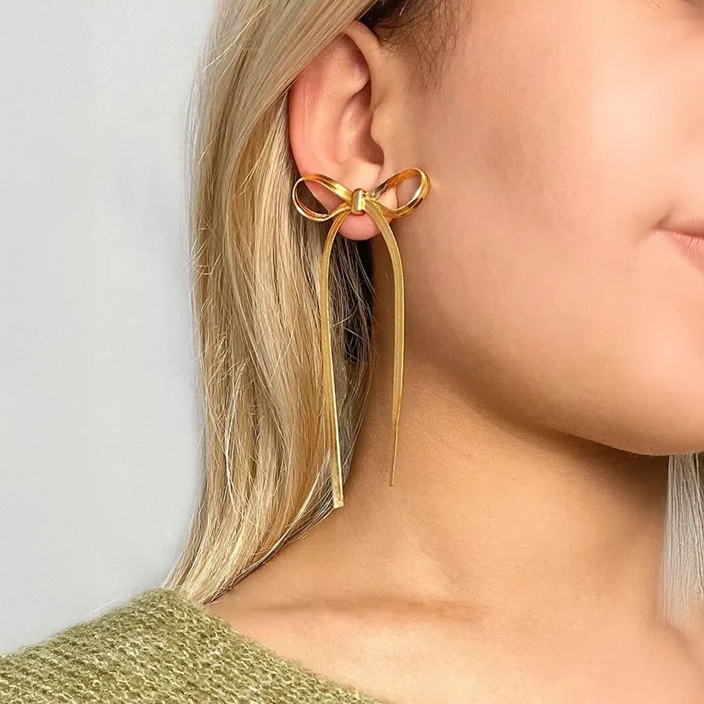 Sarella | Boucles d’oreilles nœud et chaîne serpent dorée