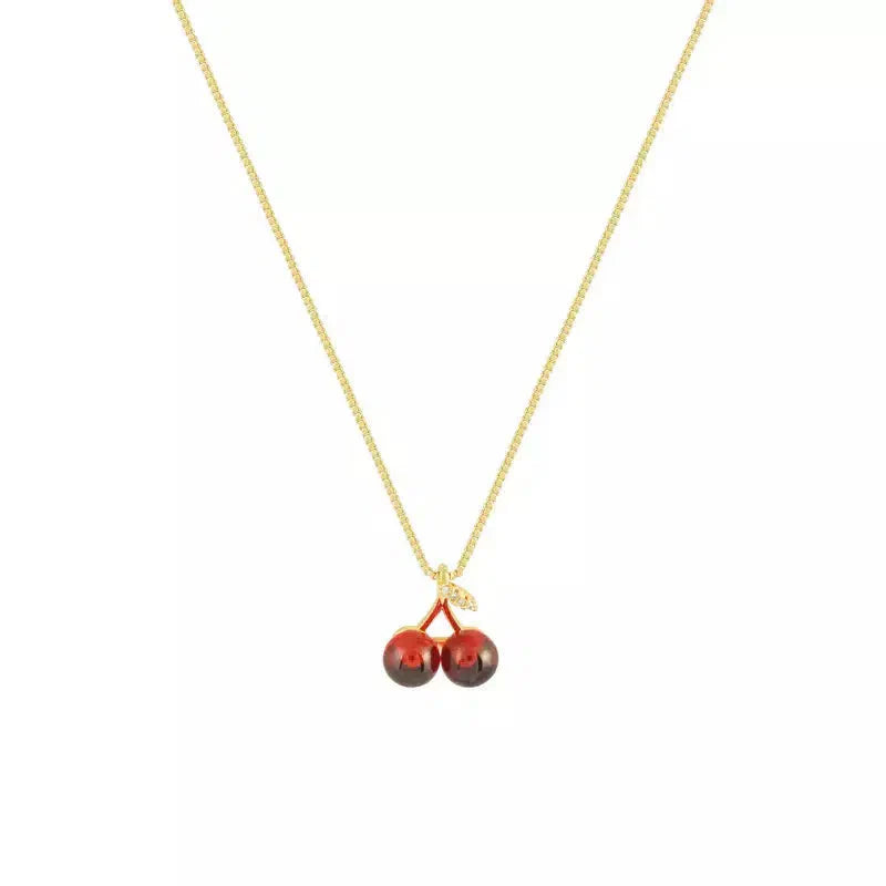 Cléora | Collier doré à breloques cerises scintillantes